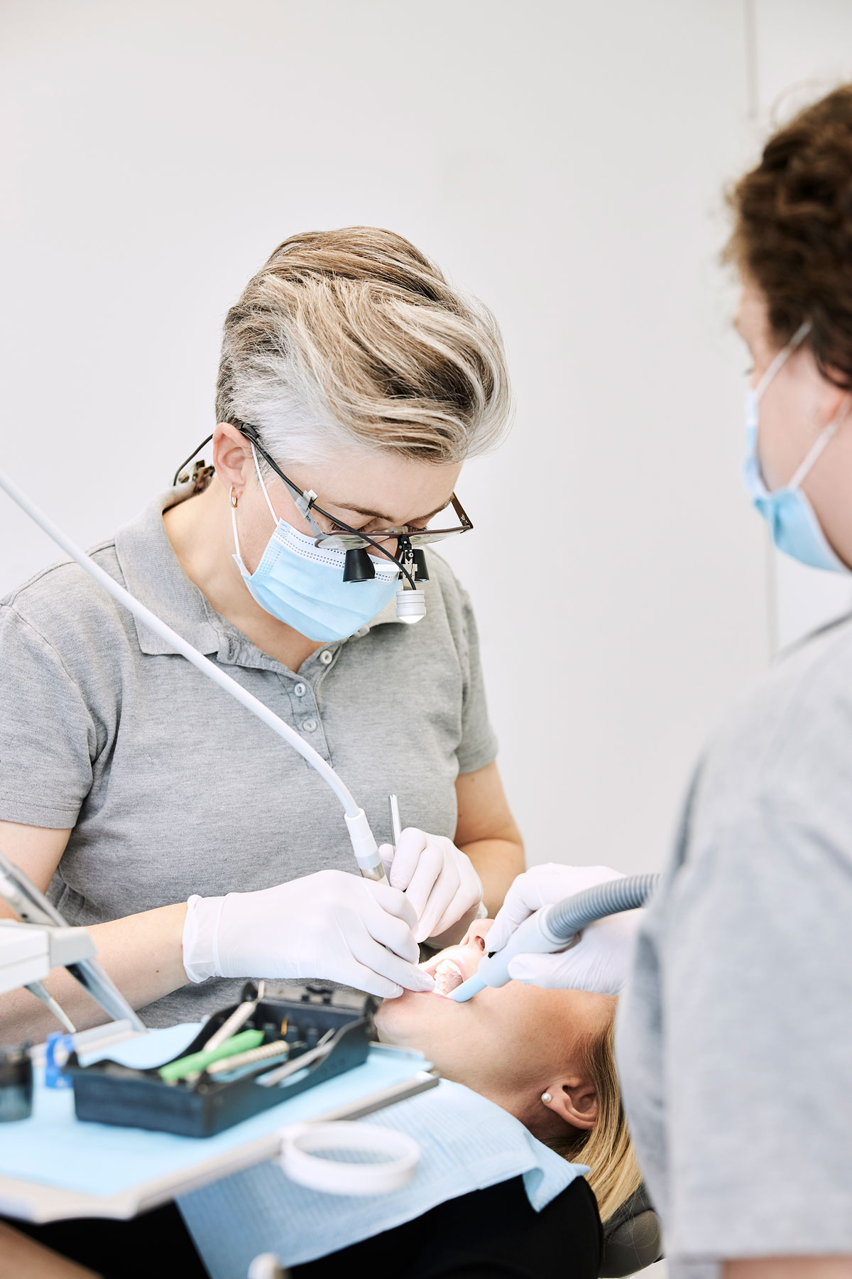Dentist performing treatment at the clinic